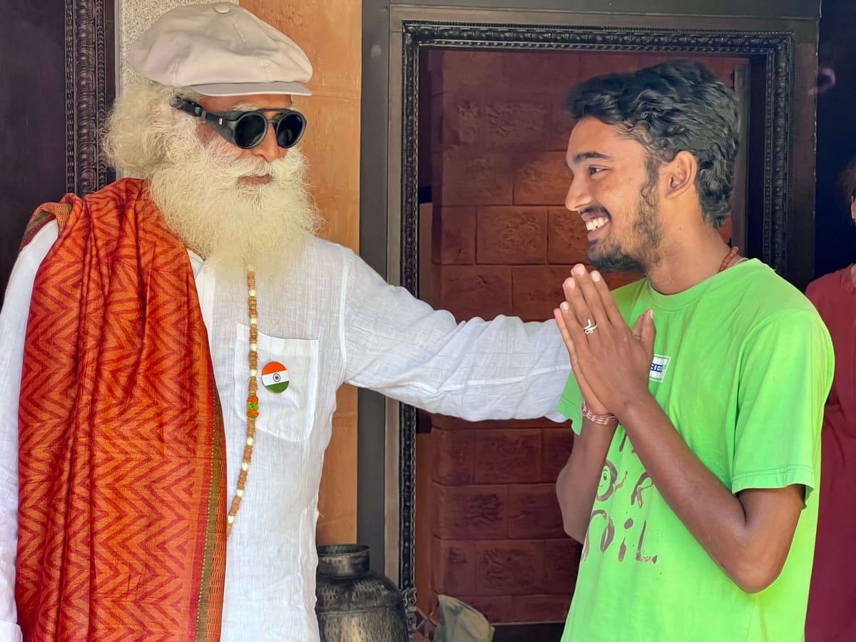 Sahil Jha greeting Sadhguru with folded hands